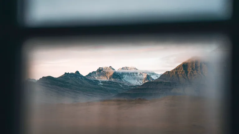 Mountain view framed by window