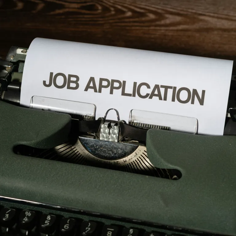 typewriter with job application