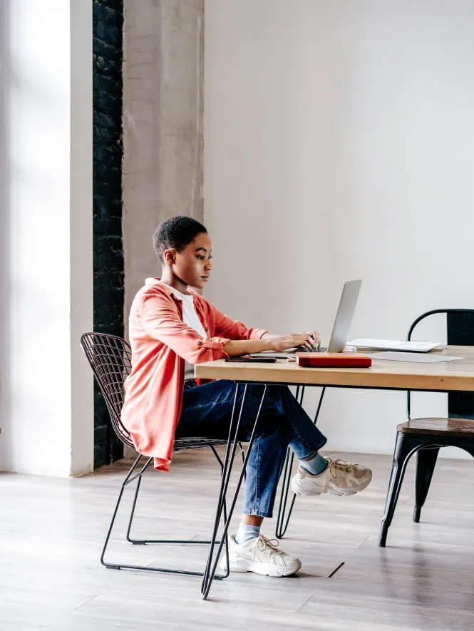woman working on laptop at desk